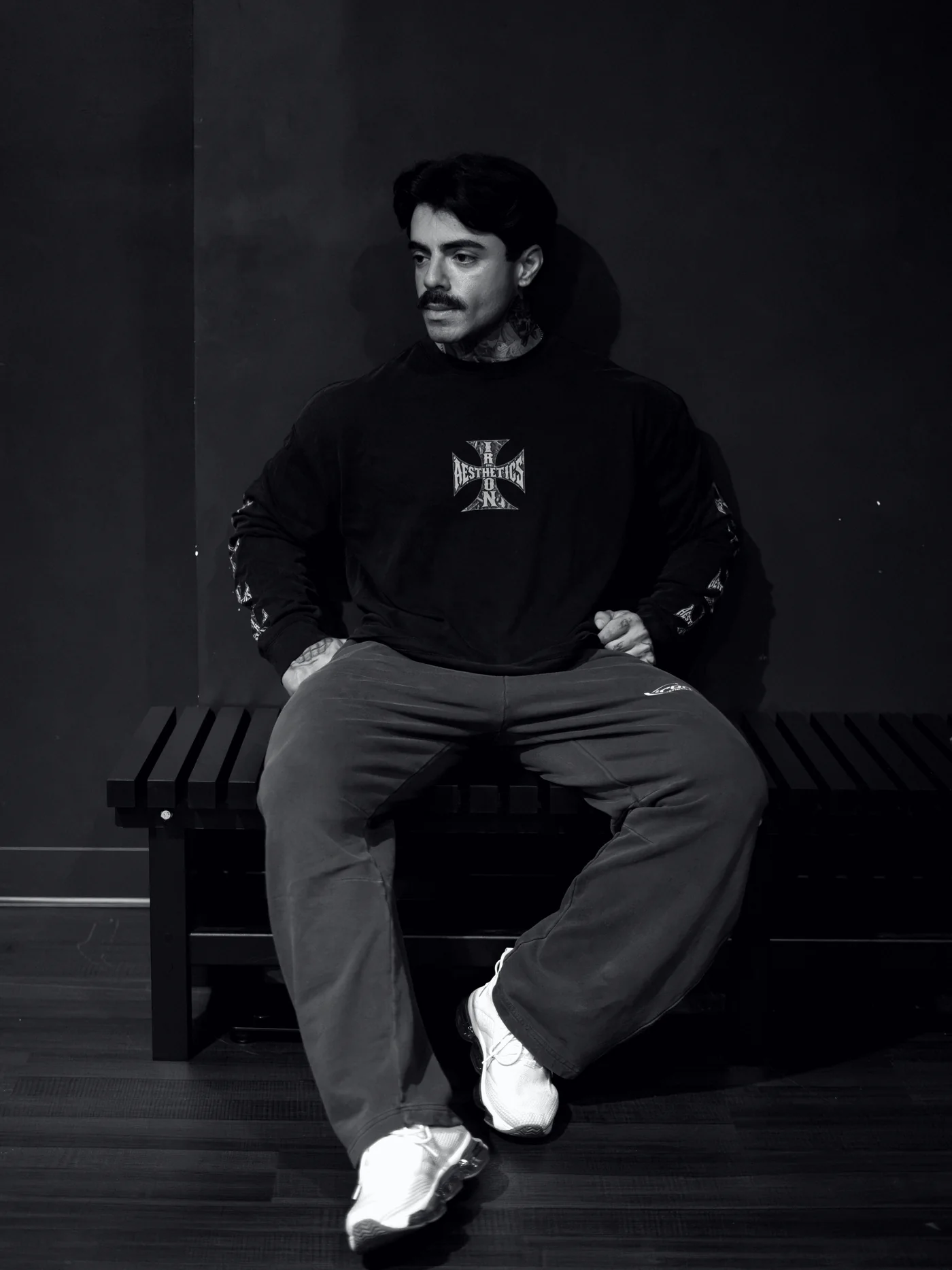 The Vintage Washed Long Sleeve, worn on a gym bench